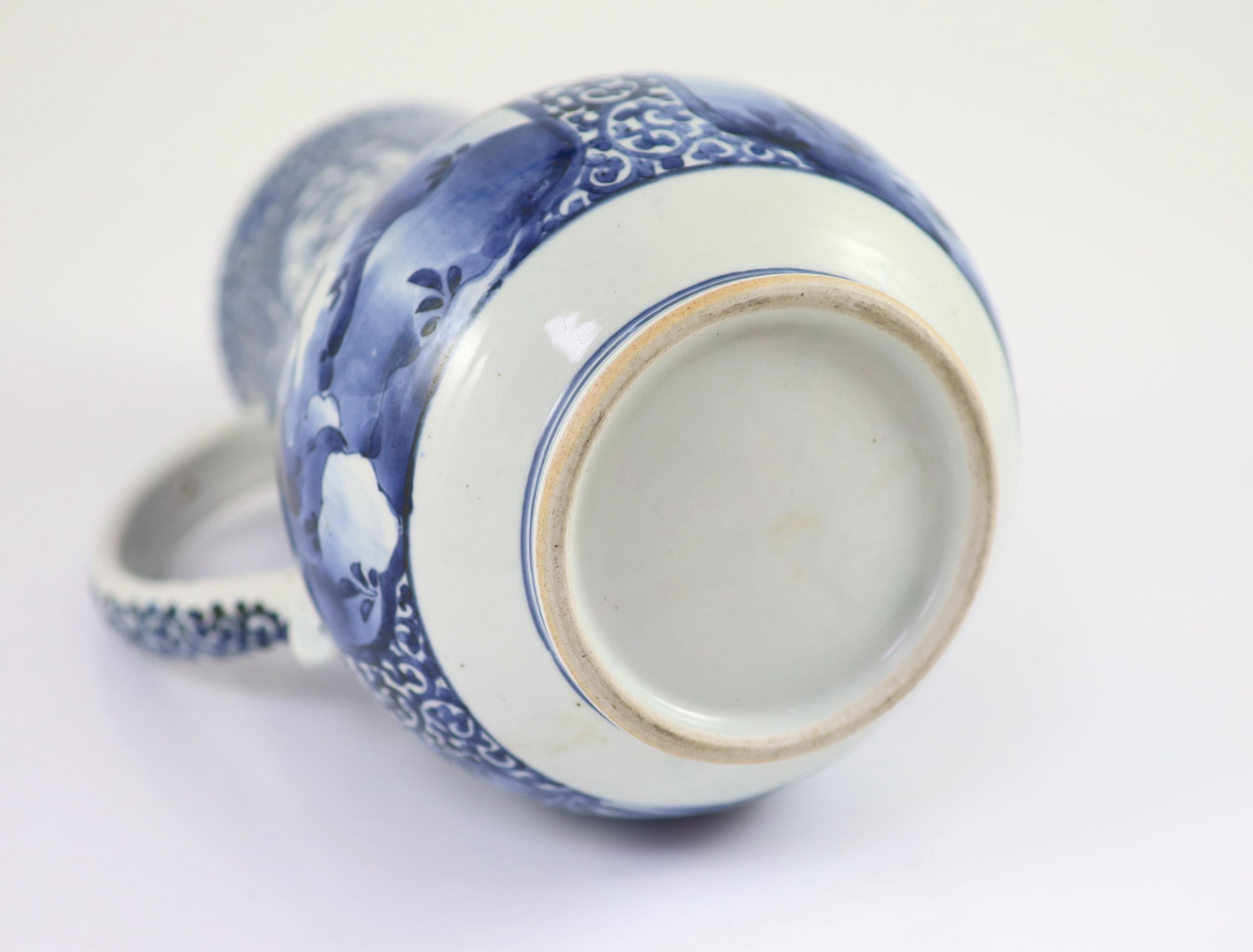 A Japanese Arita blue and white tankard, c.1700, 23.8 cm high